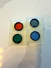 Four Celestron 1.25" Filters, 21, 56, 80A, 96, Guc. Fixed Price $20.00.